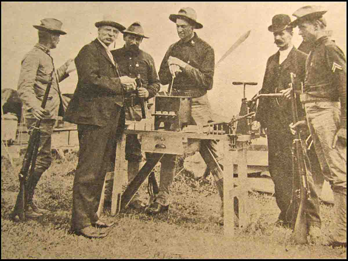 John Barlow displays his wares at Sea Girt in 1905. Behind him and to his right, is standout Captain C.B. Winder of the Ohio National Guard, Leech Cup winner in 1903 and 1908 Olympic Rifle team member.